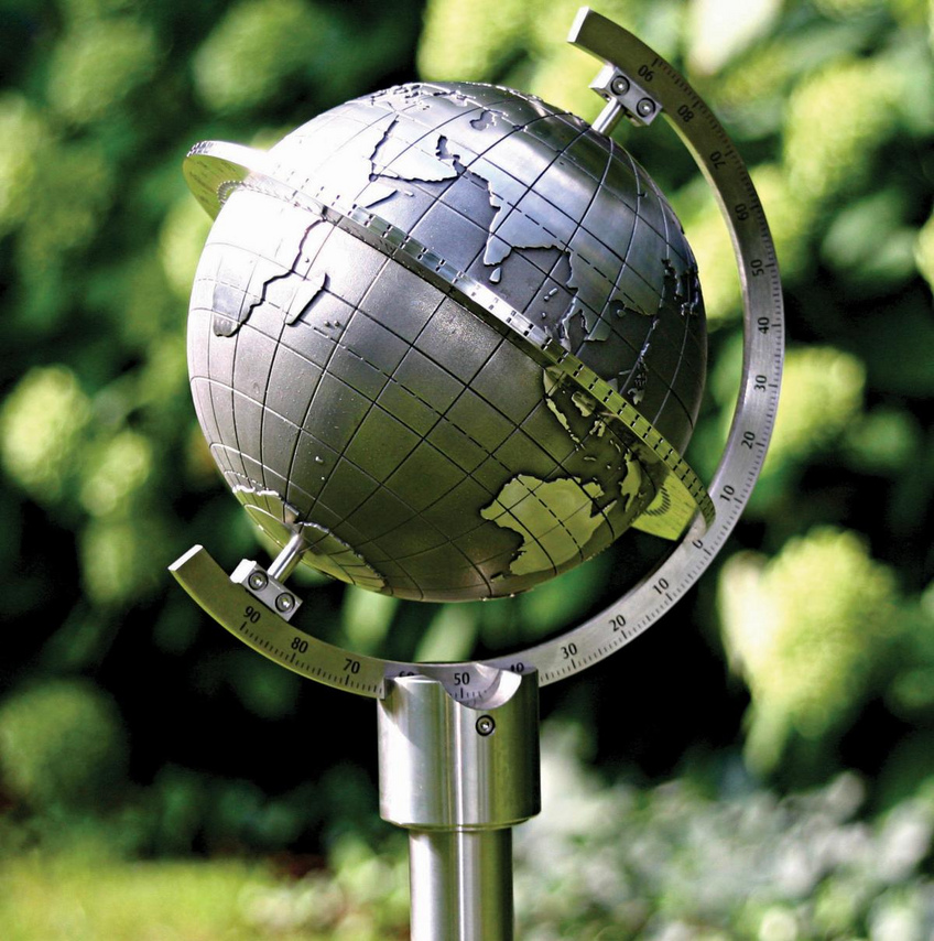 A globe sculpted in stone or cast in steel shows the true illumination of the earth by the sun in real time. A globe sculpted in stone or cast in steel shows the true illumination of the earth by the sun in real time.