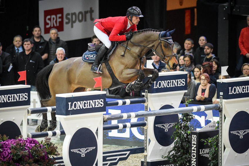 Swiss rider Pius Schwizer on PSG Future over the Longines fence. Swiss rider Pius Schwizer on PSG Future over the Longines fence.